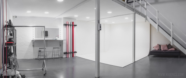 Versatile event space with clean backdrop, ideal for presentations and workshops.