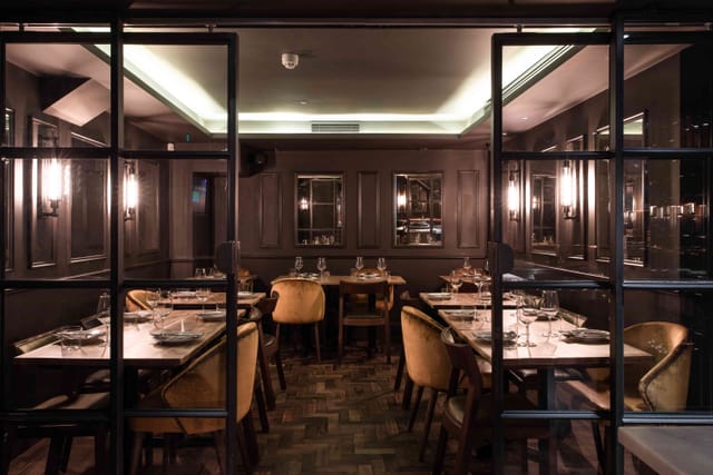 Elegant private dining room at Ember Yard, perfect for intimate gatherings and corporate dinners.