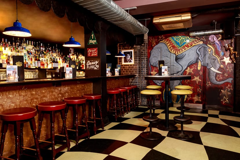 Vibrant bar venue with elephant mural, perfect for networking events in Liverpool Street.