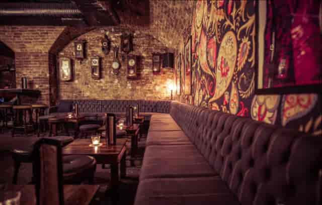 Subterranean cocktail bar with brick decor for private event venue hire or networking reception.