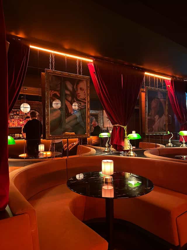 Hidden Society venue with theatrical velvet decor for exclusive evening receptions and VIP events.