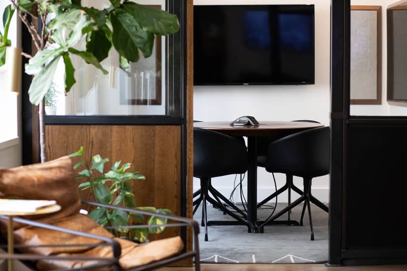 Modern meeting room with sleek table, ideal for collaborative events and presentations.