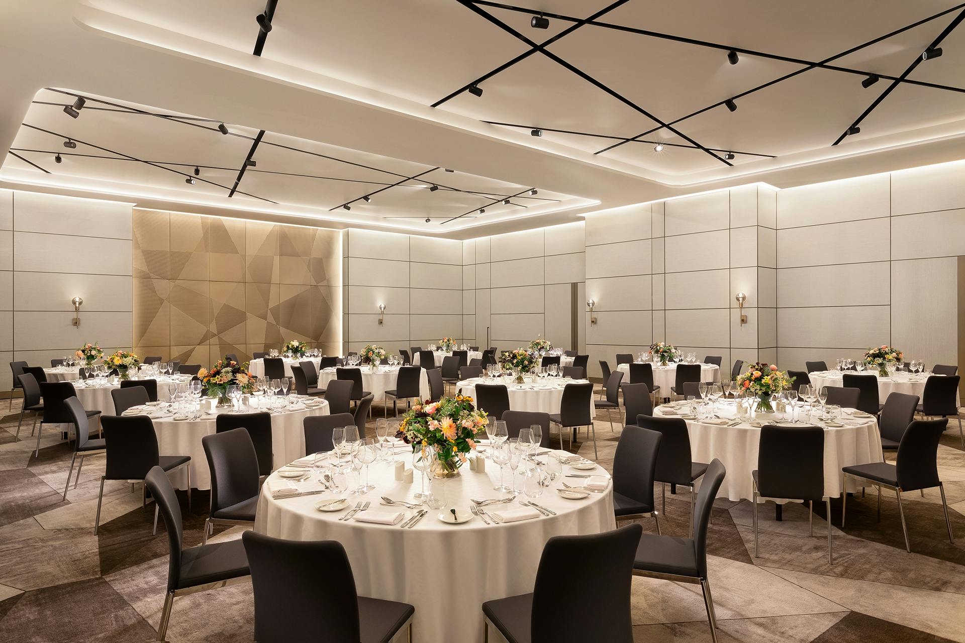 Elegant Westin Ballroom in London, set for formal corporate events with floral centerpieces.