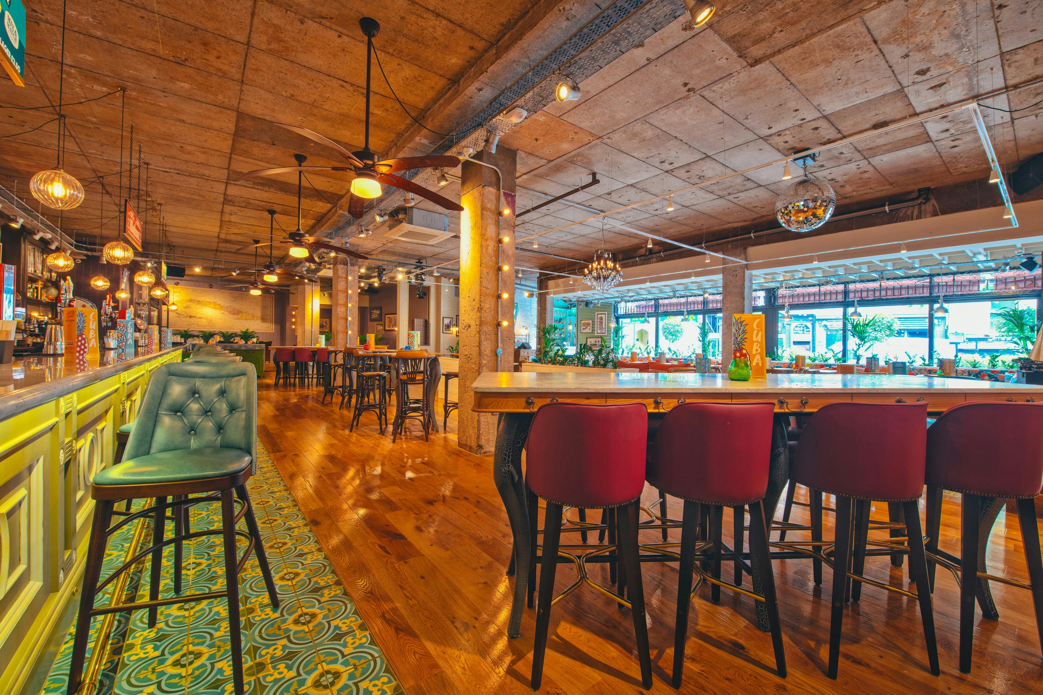 Stylish event venue with vibrant bar and natural light in Revolucion de Cuba Newcastle.