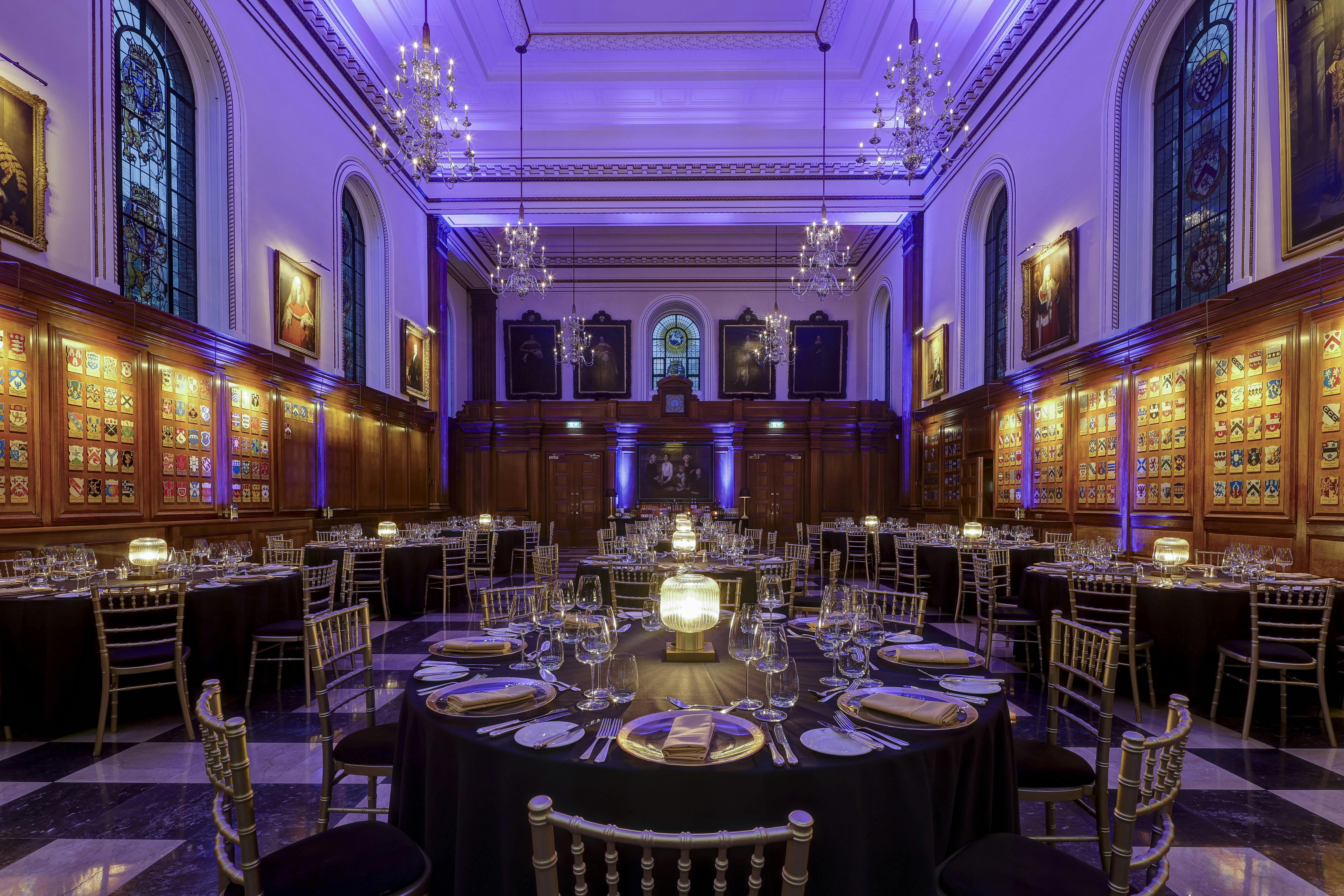 Elegant banquet hall with black linens, ideal for corporate dinners and weddings.