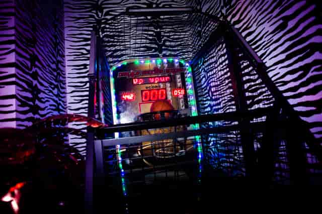 Neon-lit arcade game at Wyld Club, perfect for corporate events and parties.