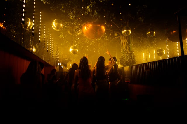 Vibrant Wyld Club event space with disco balls, ideal for lively parties and celebrations.