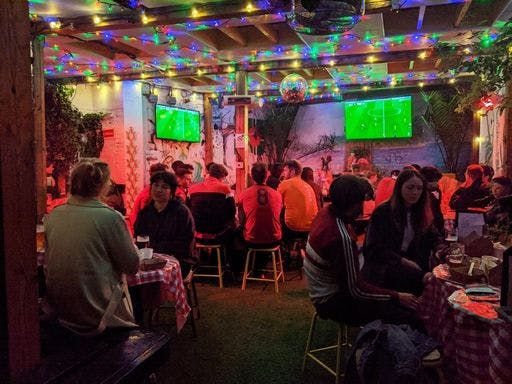 Vibrant Shacklewell Arms venue with festive lighting for casual gatherings and watch parties.