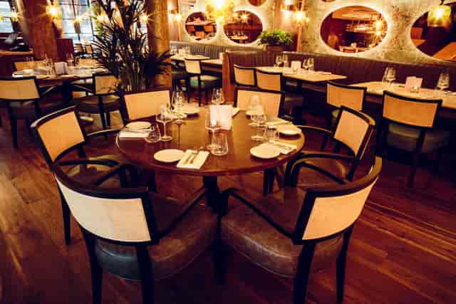 Elegant dining area in GupShup Hale, ideal for intimate meetings and private events.