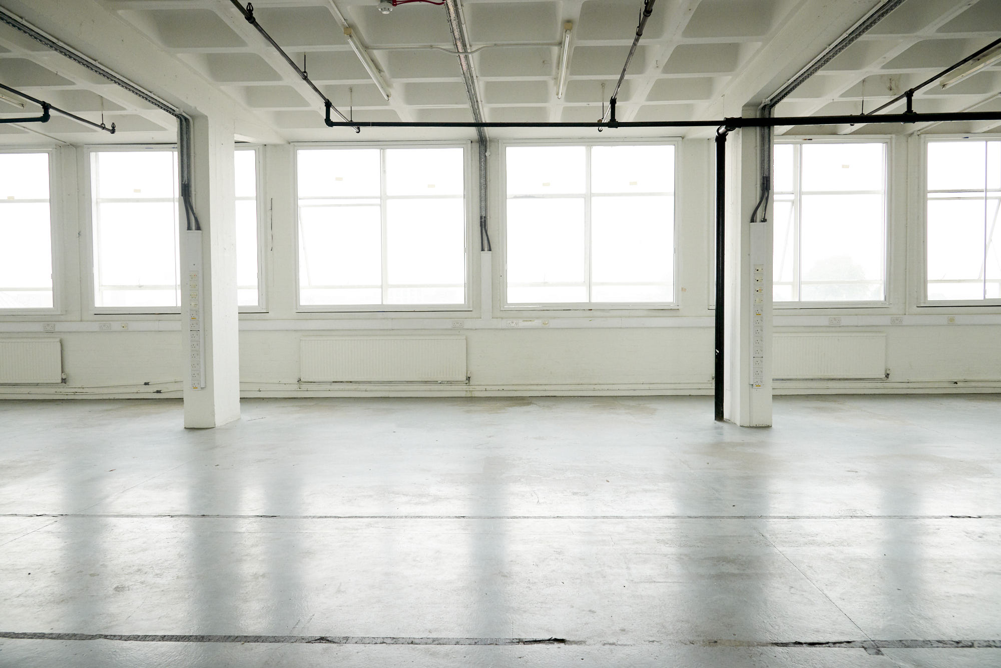 Spacious FH3 Studio venue with large windows, perfect for events and workshops. - Banner