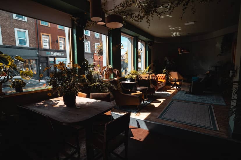 Cozy venue with natural light, perfect for intimate meetings and workshops.