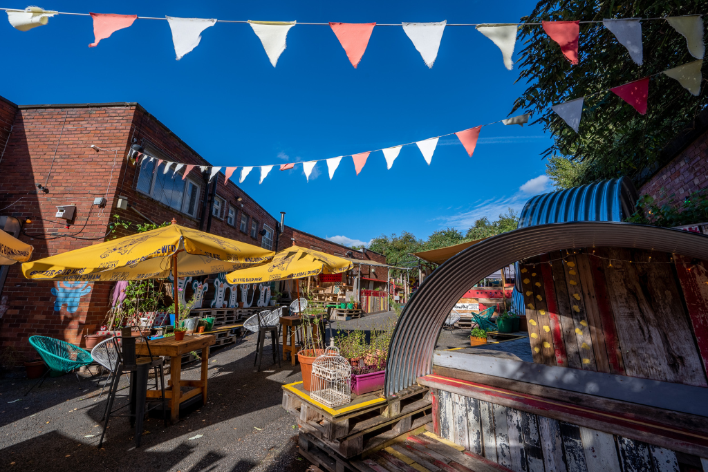 Vibrant outdoor event space at The Basement Bar, ideal for casual gatherings and workshops. - Banner
