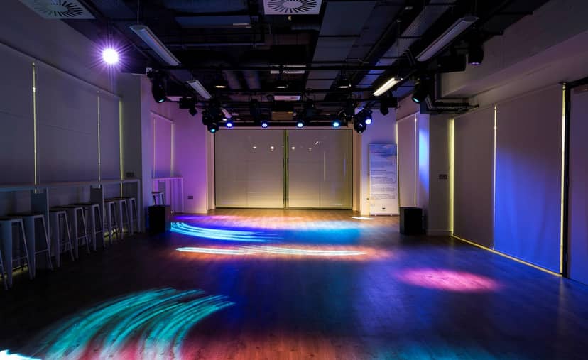 Versatile Cocoon Space with ambient lighting, ideal for meetings and events.