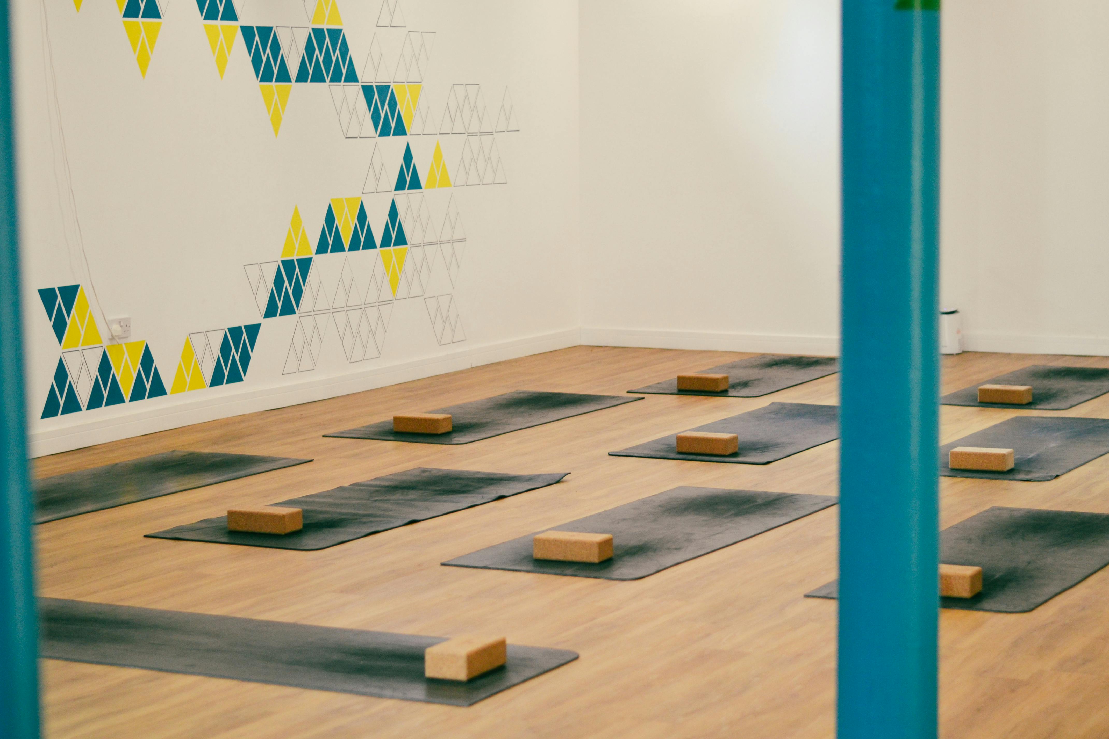 Serene yoga studio with mats, ideal for wellness retreats and team-building events.