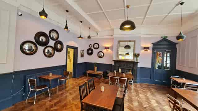 Stylish event space at The Windmill Bar with warm lighting for intimate gatherings.