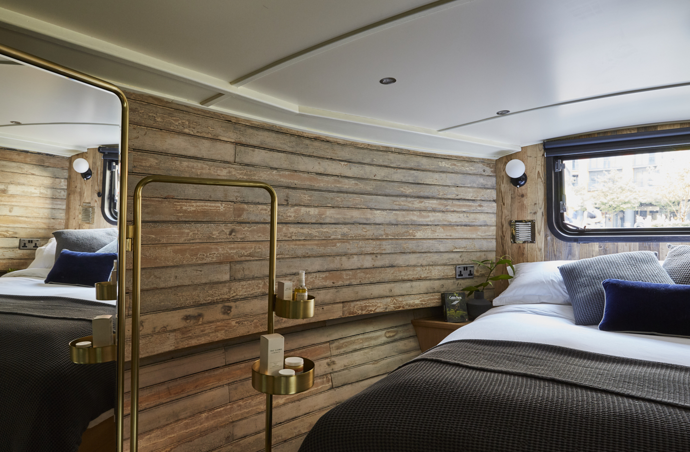 Boutique hotel boat in Paddington, featuring warm wooden walls for retreats and workshops. - Banner