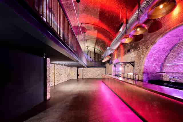 Stylish industrial event space with exposed brick and high ceilings at The Steel Yard.