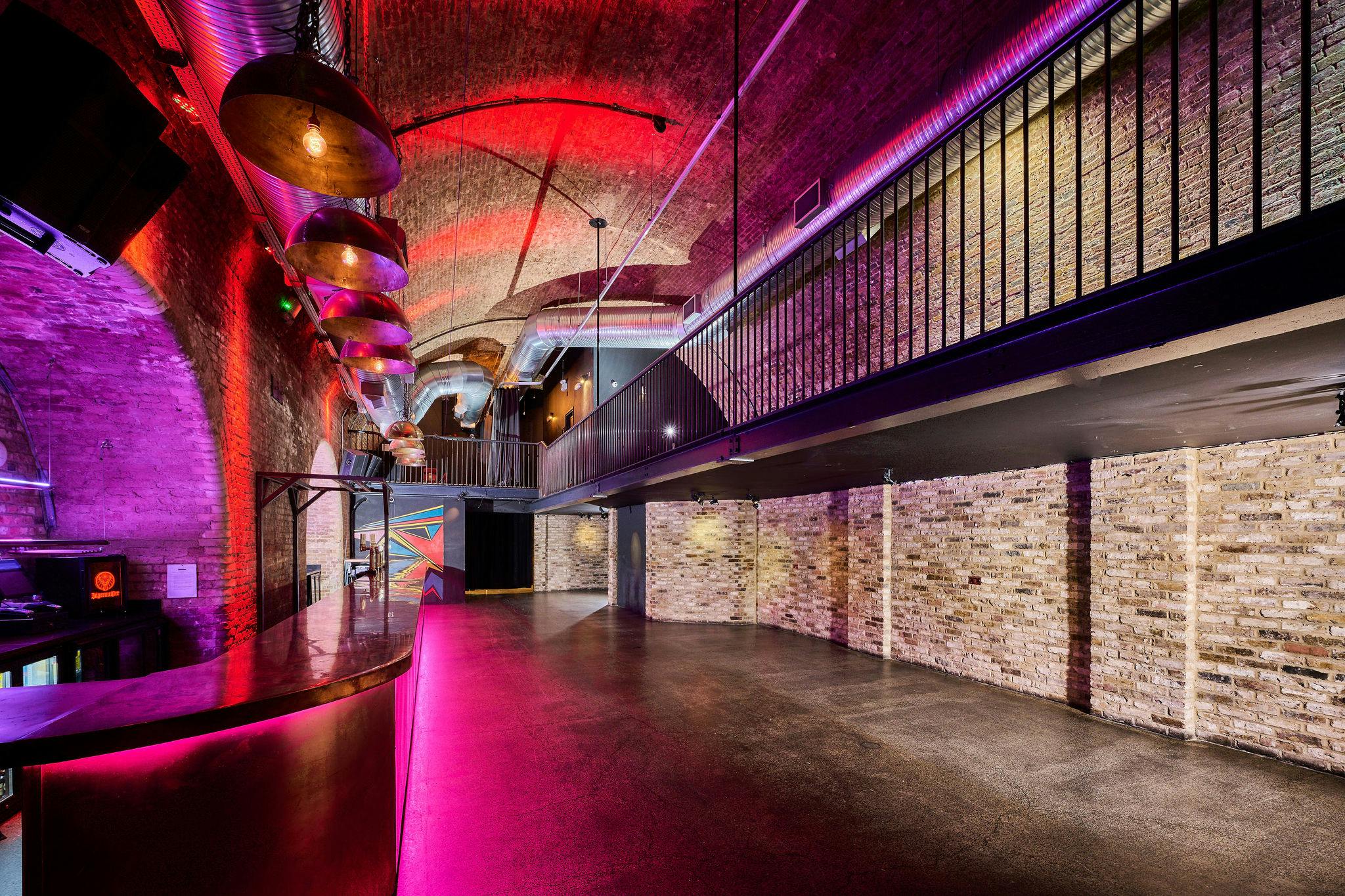 Arch 3 at The Steel Yard: modern industrial event space with exposed brick, ideal for gatherings.