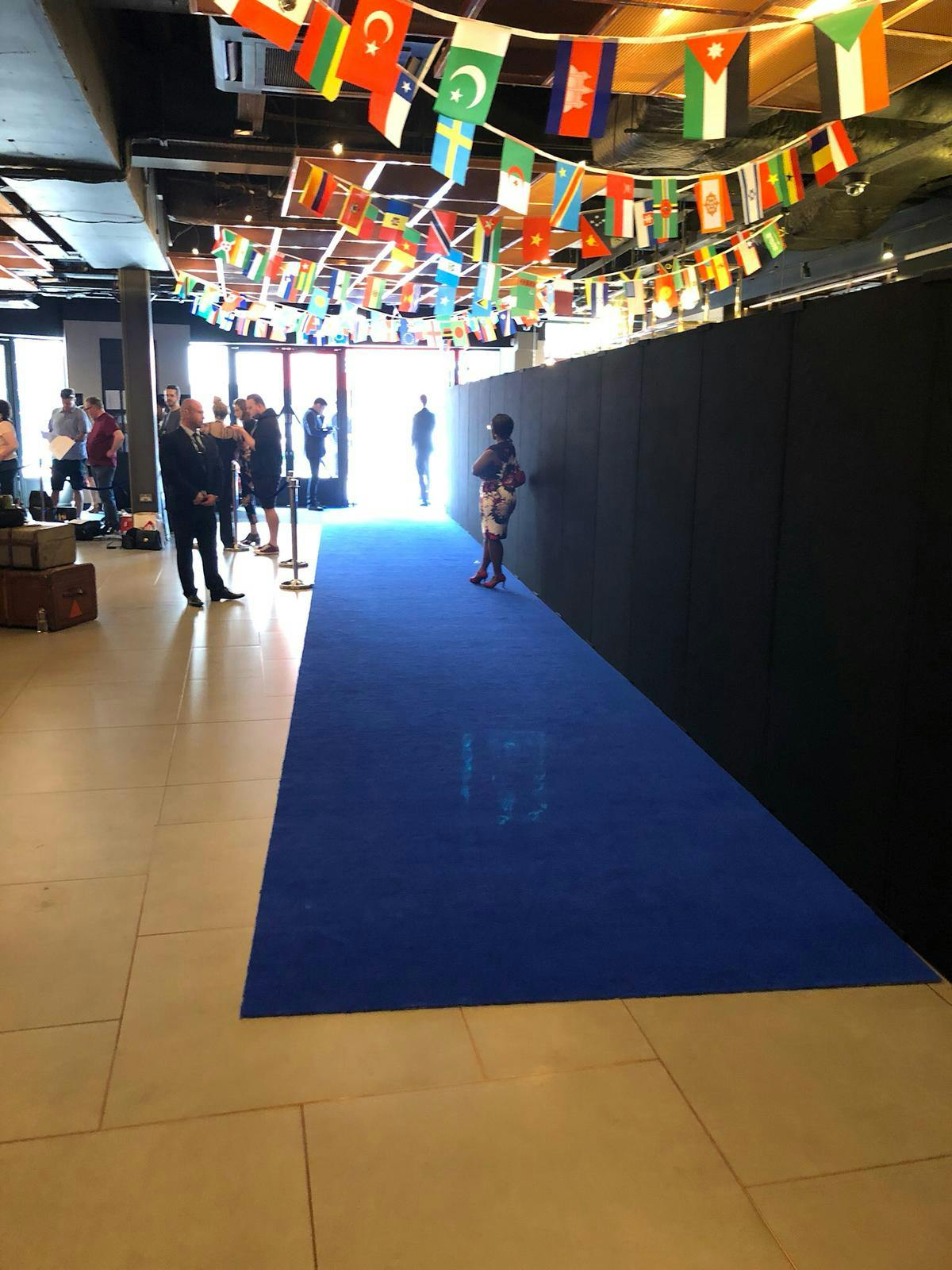 VUE West End Screen 6 with blue carpet, sleek backdrop for events and branding.