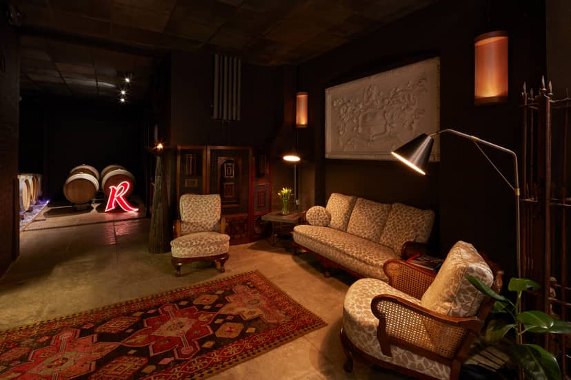 Cozy Barrel Room at London Cru Winery, ideal for intimate meetings and networking events.