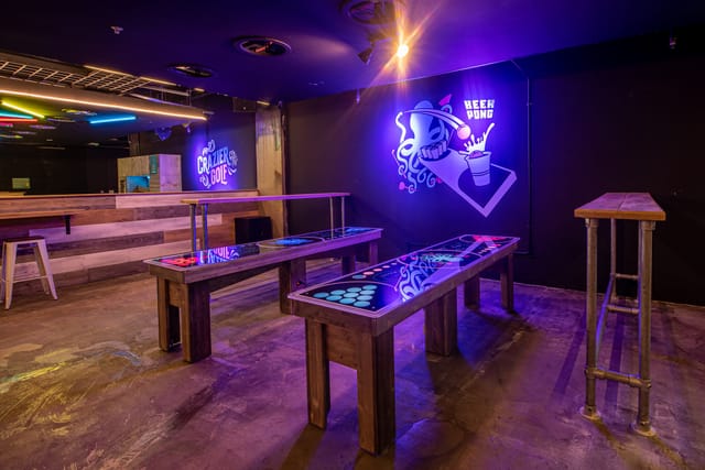 Vibrant Full Venue Hire at Boom Battle Bar with neon decor for networking events.