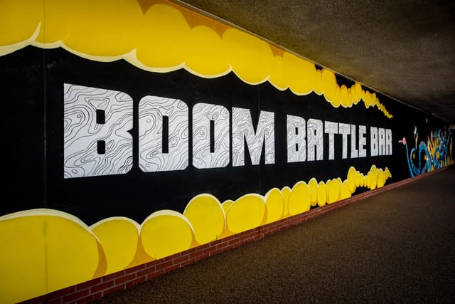 Vibrant mural at Boom Battle Bar, ideal for interactive events and team-building activities.