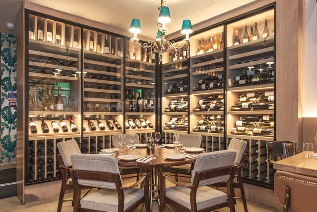 Elegant wine cellar in Meraki London, perfect for intimate gatherings and exclusive events.