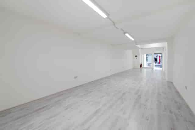 Spacious blank canvas venue with natural light for workshops and exhibitions.