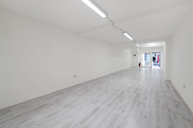 Spacious blank canvas venue with natural light for workshops and exhibitions.