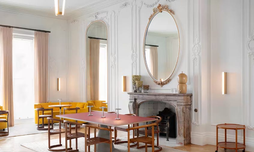 Cromwell Place Café Bar: elegant meeting space with natural light, perfect for gatherings.