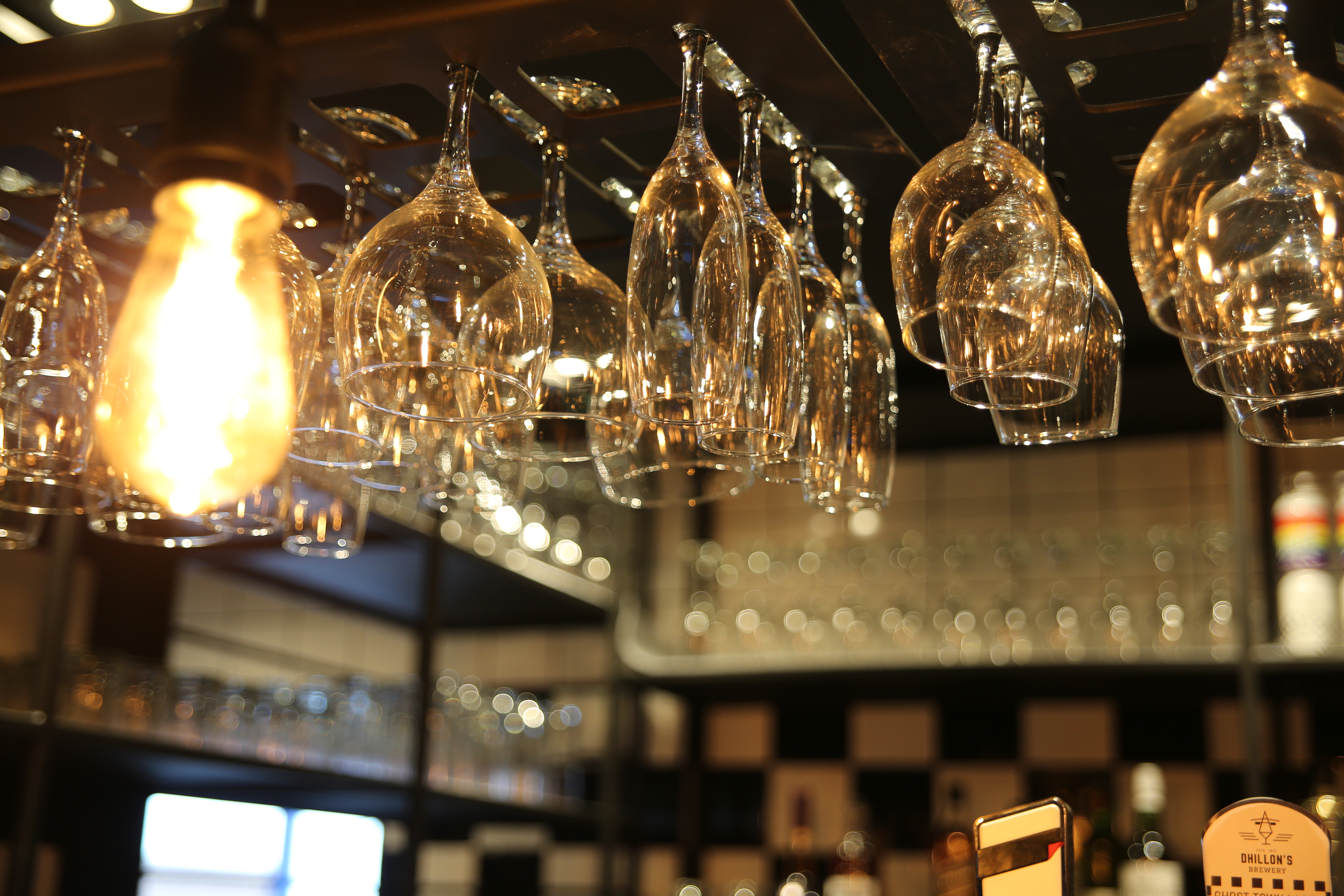 Stylish bar setup with elegant glassware in Sky Blue Tavern for networking events. - Banner