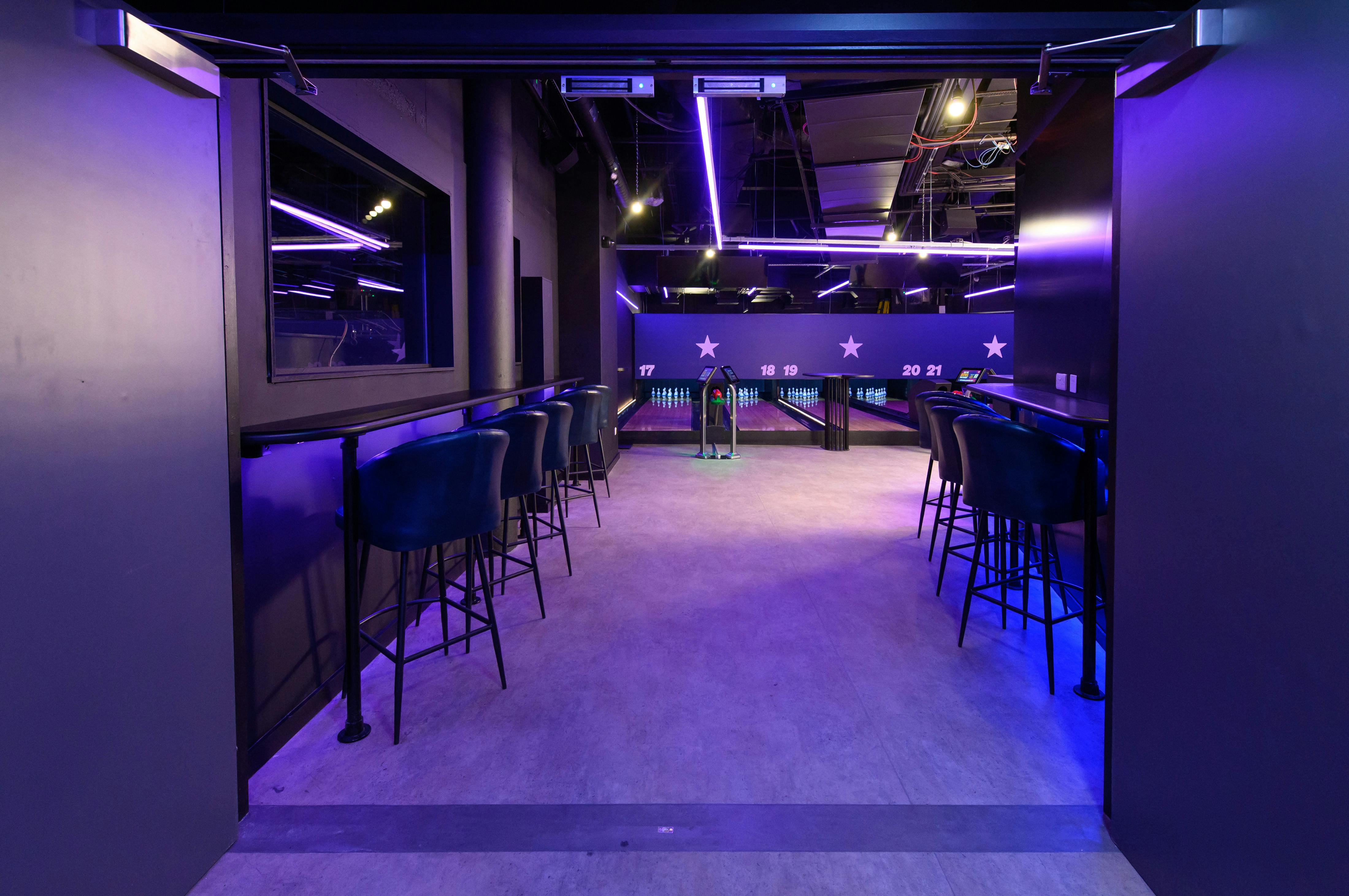 Duckpin Lounge at O2: modern event space with sleek bar seating for networking and gatherings.