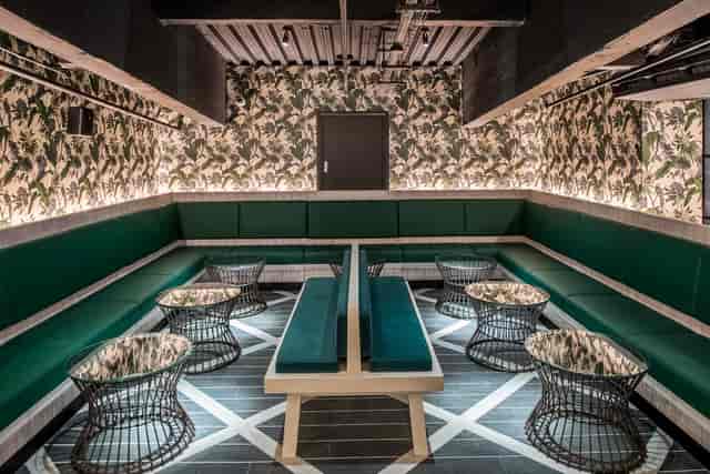 Stylish Palm Lounge at Swingers West End, perfect for meetings and brainstorming sessions.