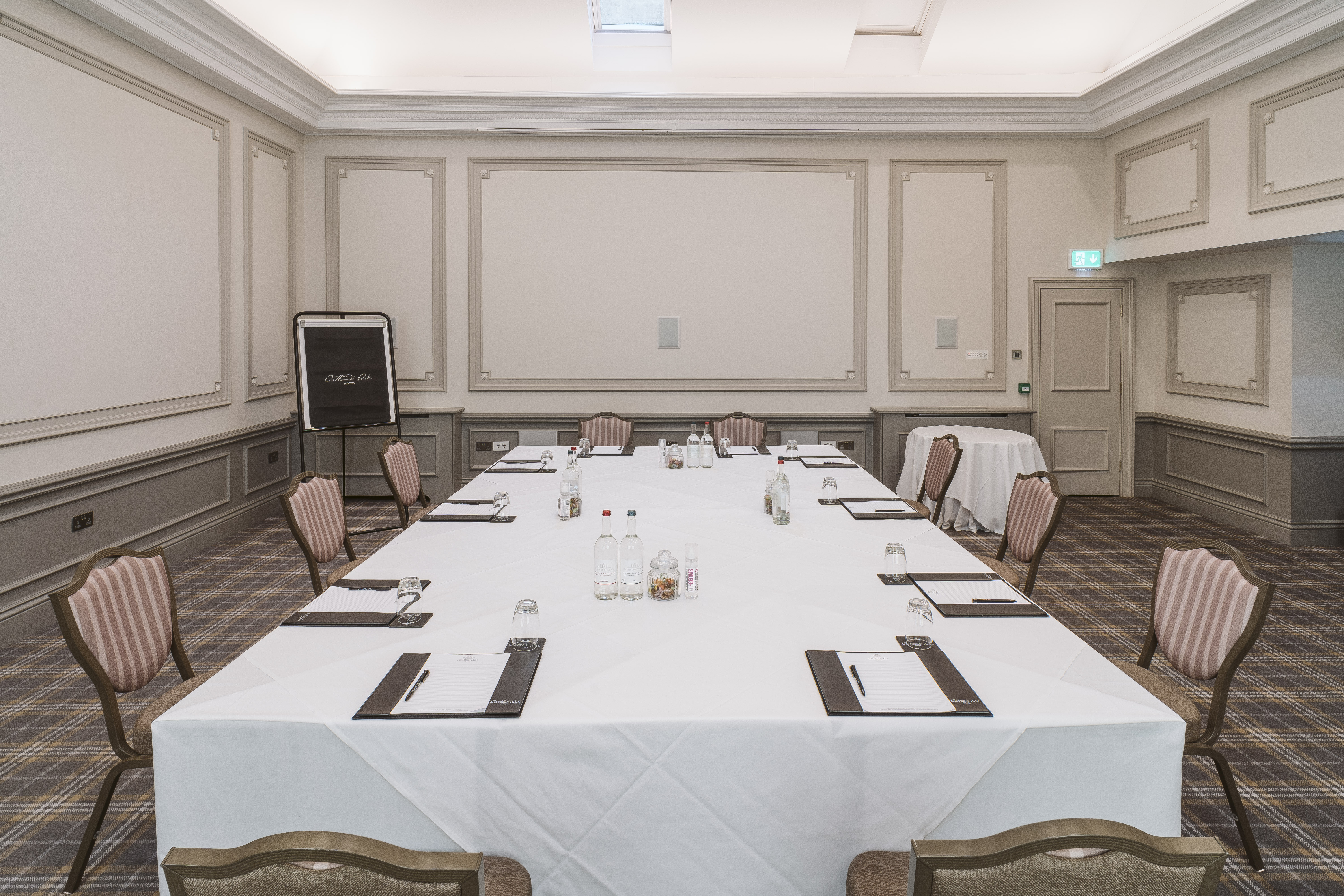 Cromwell Room at Oatlands Park Hotel, set for a professional meeting with ample lighting.