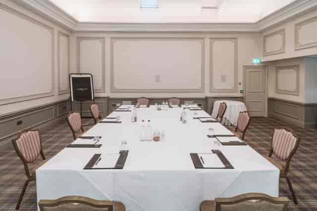 Cromwell Room at Oatlands Park Hotel, set for a professional meeting with ample lighting.