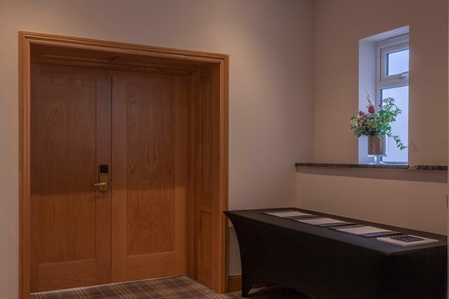 Cromwell Room entrance at Oatlands Park Hotel, elegant doors for events and gatherings.