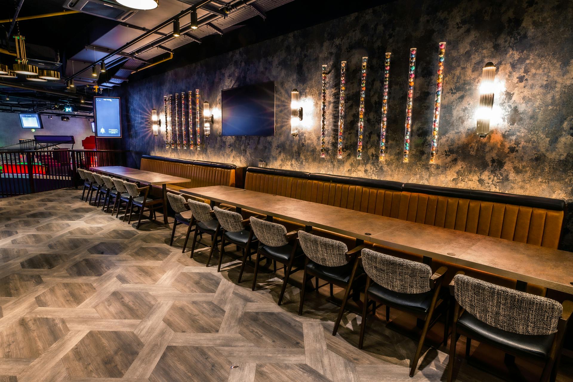 Modern event space at Puttshack Watford with stylish table setup for meetings and gatherings.