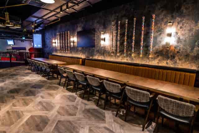 Modern event space at Puttshack Watford with stylish table setup for meetings and gatherings.