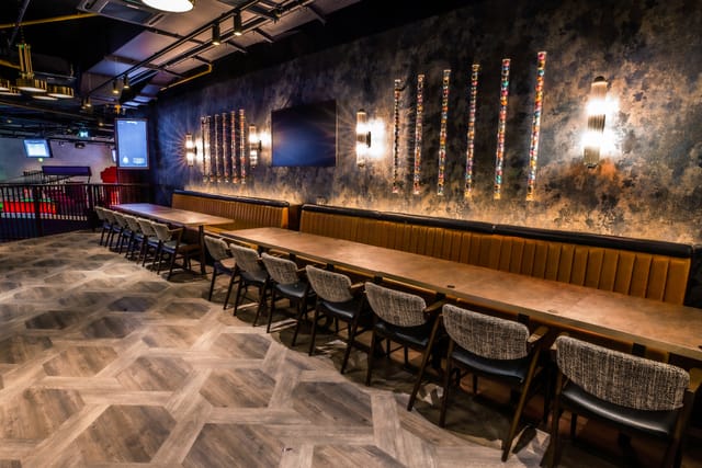 Modern event space at Puttshack Watford with stylish table setup for meetings and gatherings.