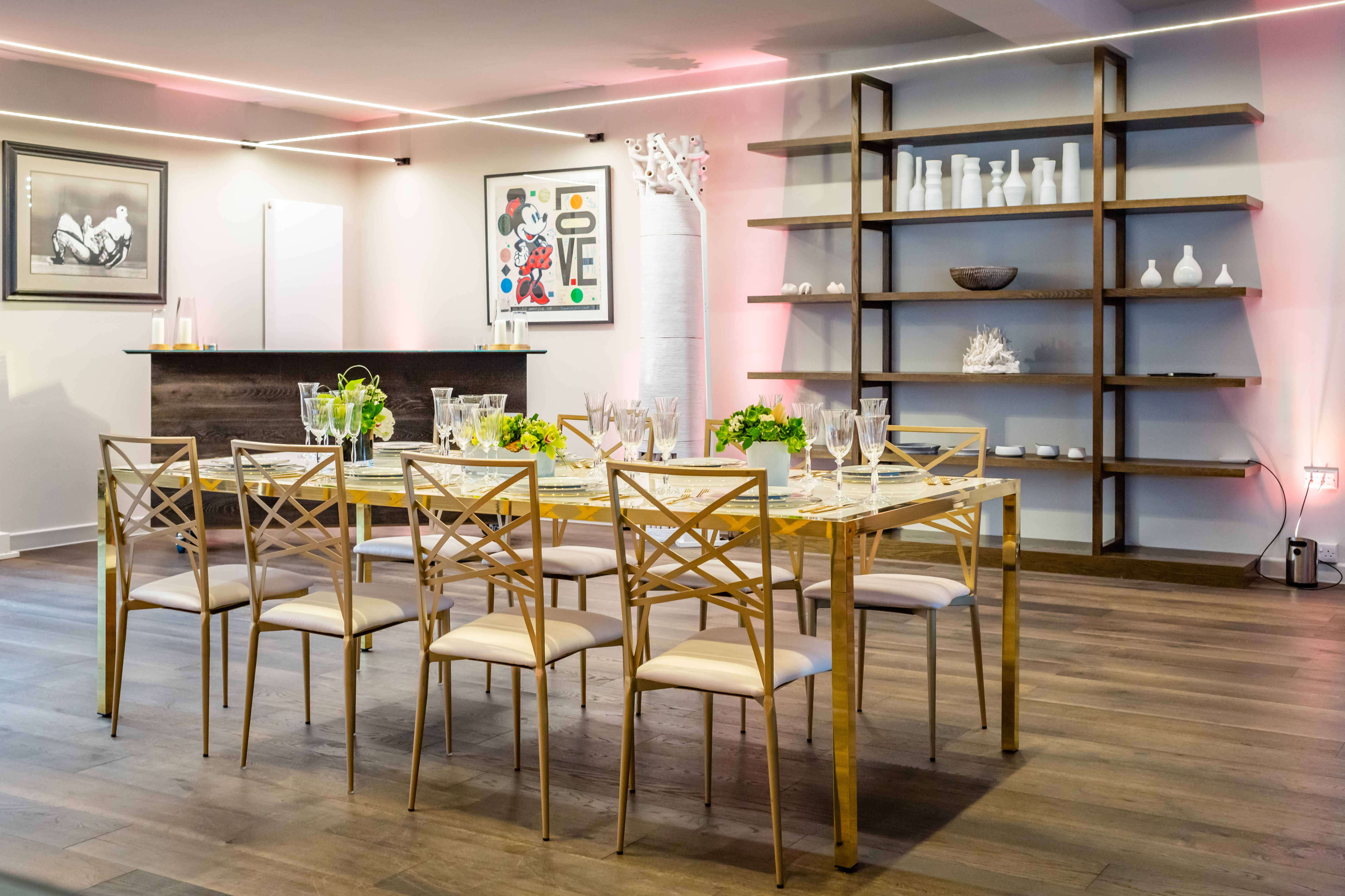 Elegant meeting space with long dining table, ideal for networking events. - Banner