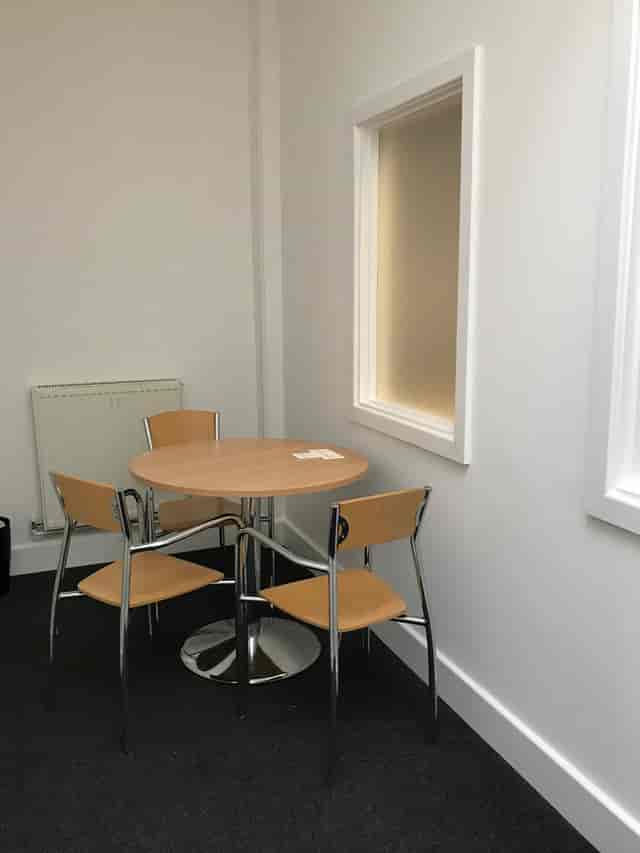 Small Meeting Room in Faraday House with round table, ideal for brainstorming sessions.