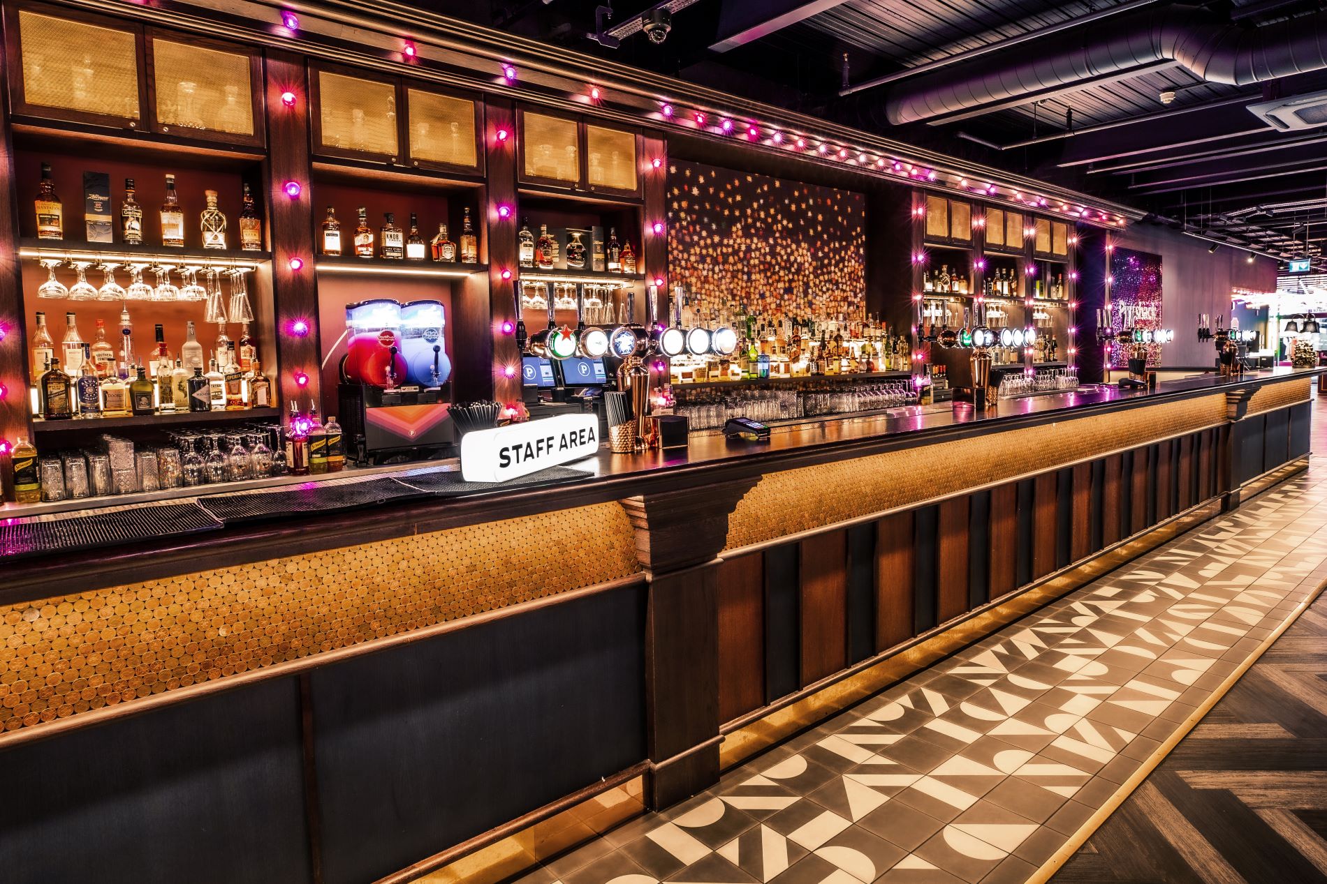Stylish bar at Puttshack Watford, perfect for Christmas networking events and cocktail receptions. - Banner