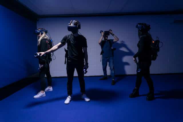Group enjoying immersive VR experience at DNA Virtual Reality Arcade, Camden.