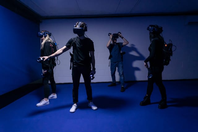 Group enjoying immersive VR experience at DNA Virtual Reality Arcade, Camden.