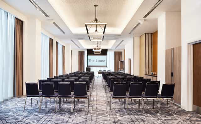 Bernstein Suite conference room with black chairs, ideal for corporate events and workshops.