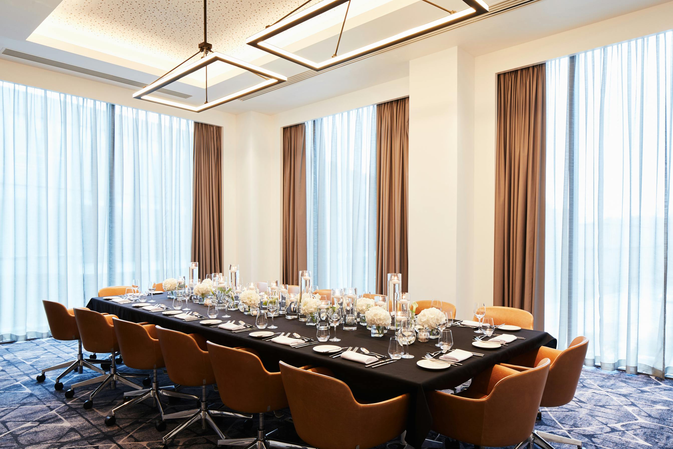 Executive Boardroom at Hyatt Regency Manchester, elegant dining setup for corporate events.