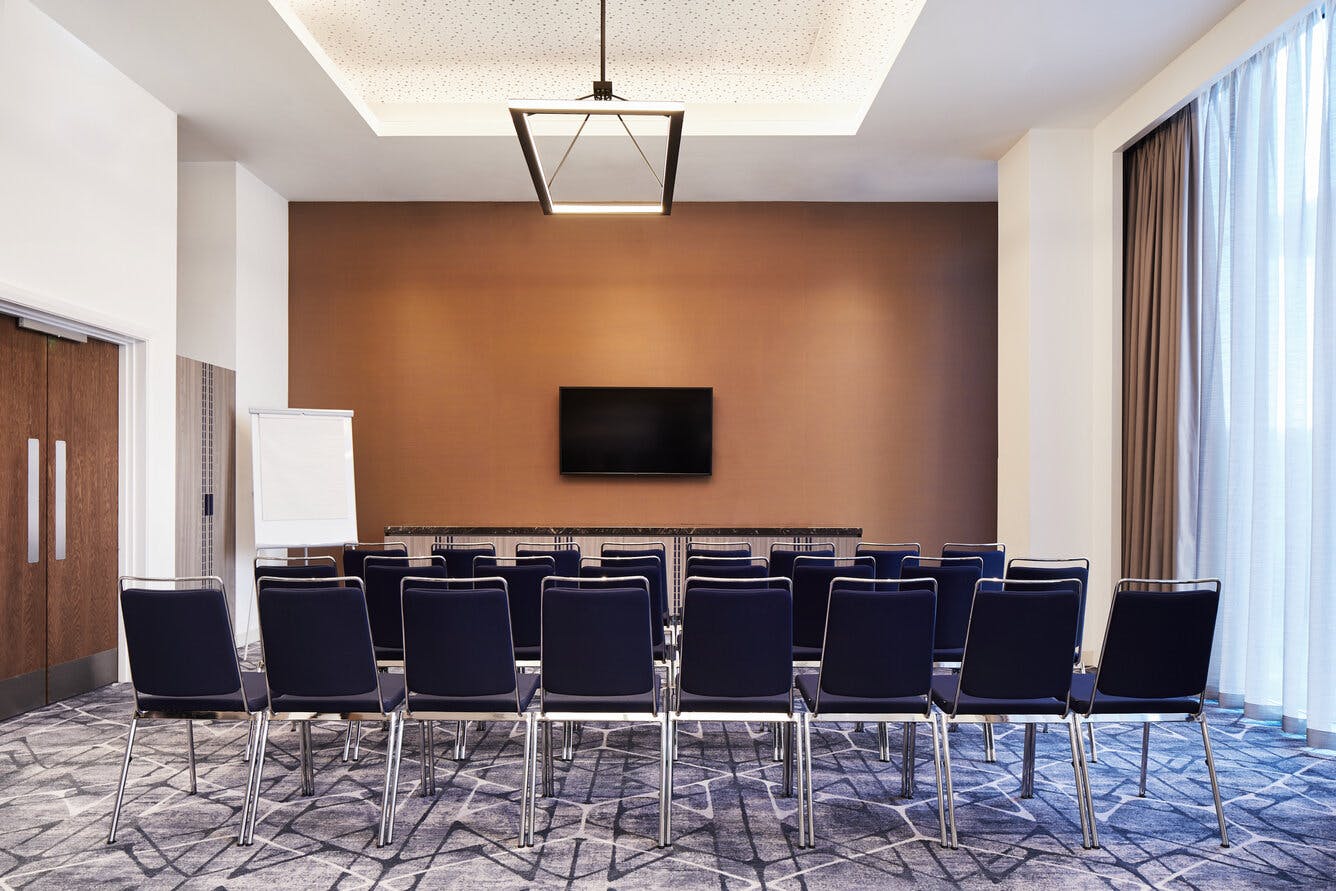 Eddington Room at Hyatt Regency Manchester, modern meeting space for workshops and presentations.