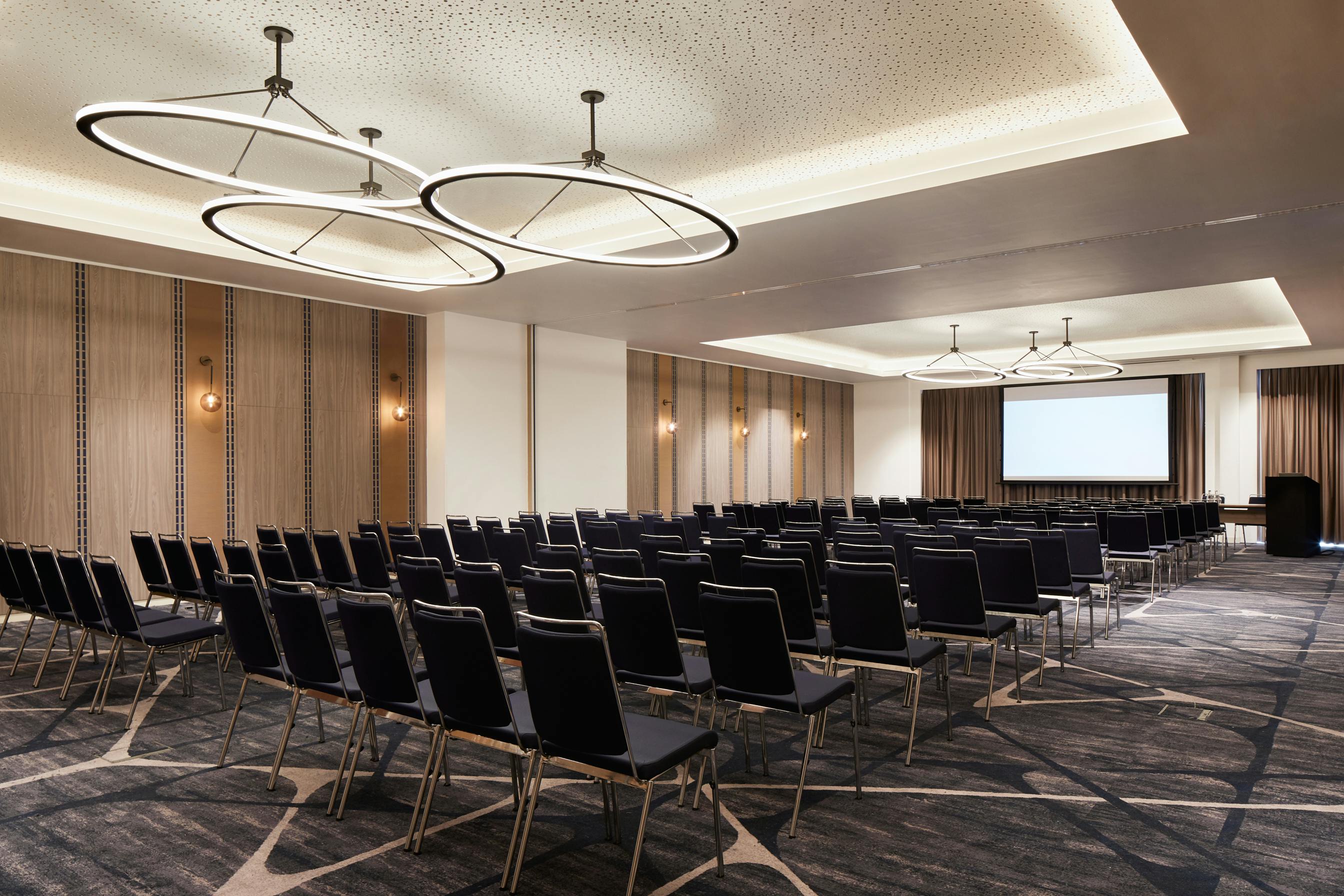 Hyatt Regency Manchester meeting room with black chairs, ideal for corporate events and workshops.