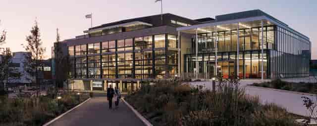 Modern Welcome Building venue with glass facades, perfect for events and meetings.