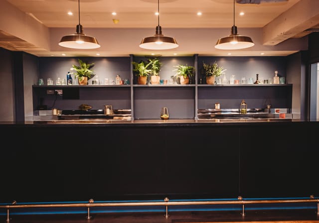 Event space at The Storehouse in Whitworth Locke with sleek bar and modern ambiance.